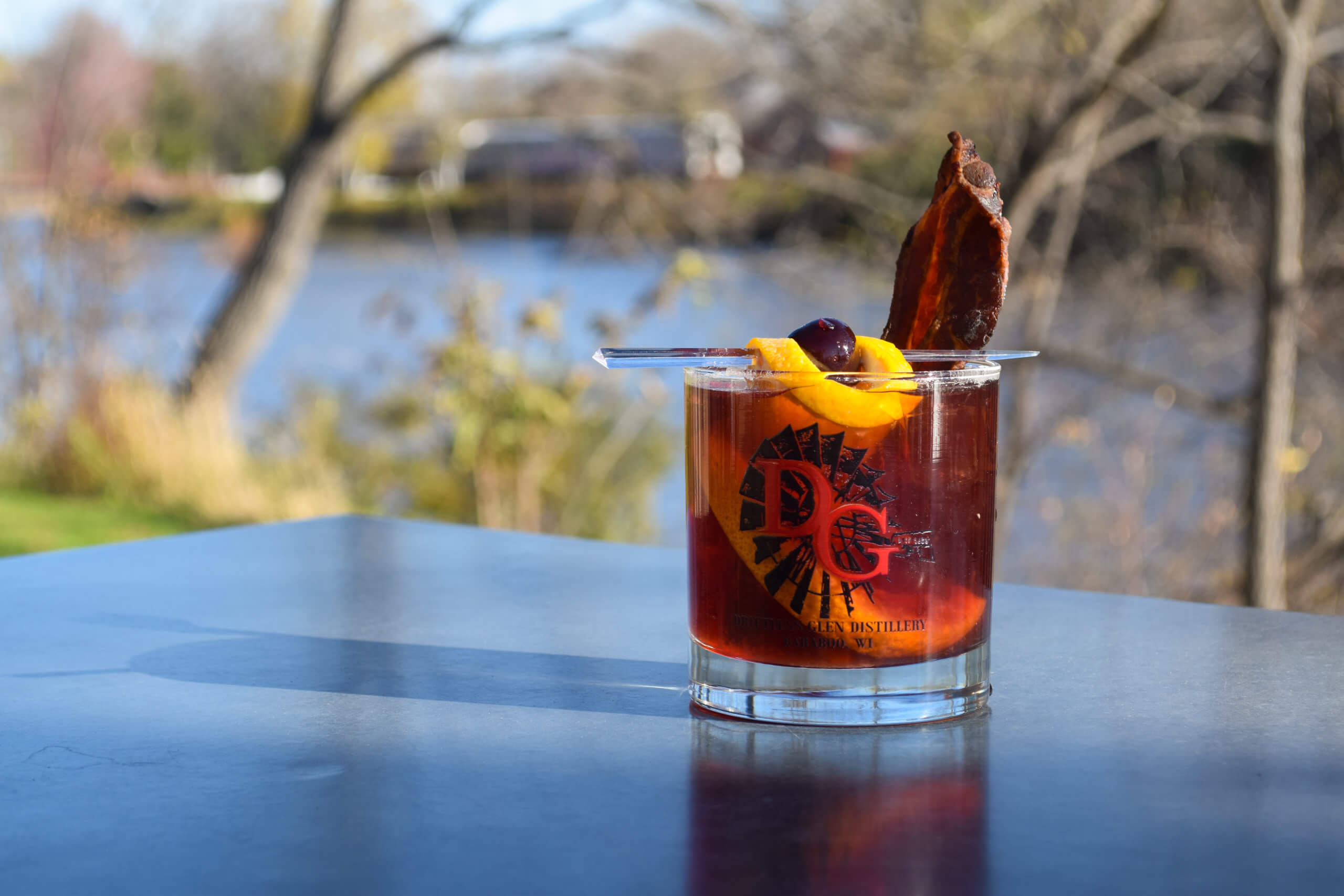 Old Fashioned cocktail by the river